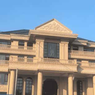 梧州黄金麻别墅外墙干挂石材效果示例